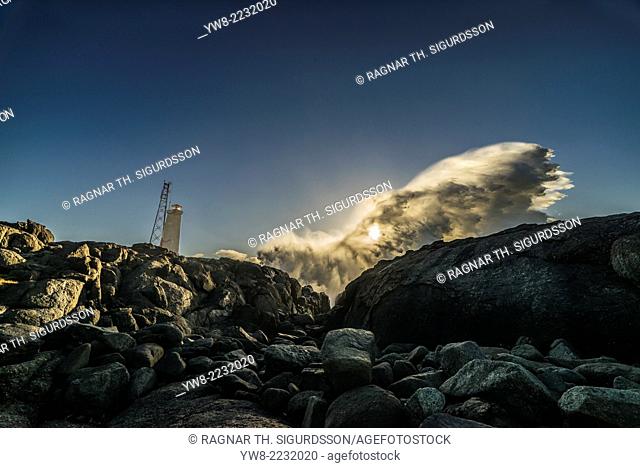 Lighthouse and waves crashing, Stokksnes by Hofn and Hornafjordur, Iceland