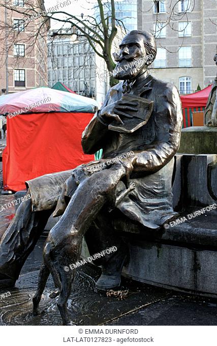 there is a bronze statue of Karel Buls, a Belgian politician and former Mayor of the City of Brussels with his dog, in Place Agoraplein at the junction of...