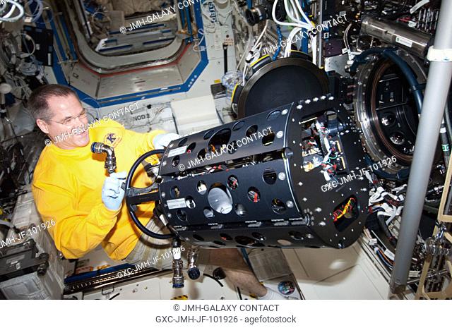 NASA astronaut Kevin Ford, Expedition 34 commander, works with the Combustion Integrated Rack (CIR) Multi-user Droplet Combustion Apparatus (MDCA) in the...