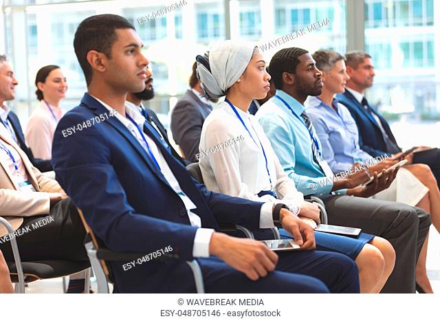 Business people attending a business seminar