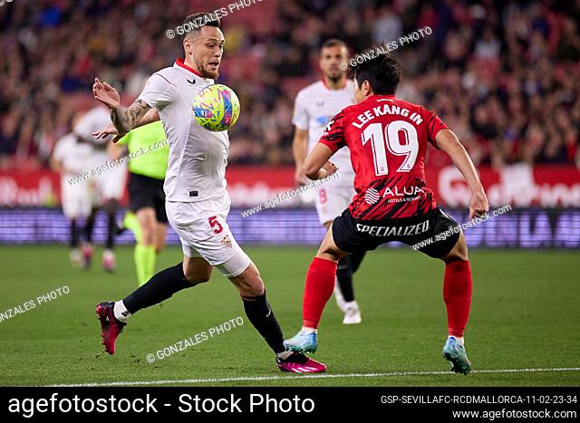 Seville, Spain. 11th, February 2023. Lucas Ocampos (5) of Sevilla FC and Lee Kang-in (19) of Mallorca seen during the LaLiga Santander match between Sevilla FC...