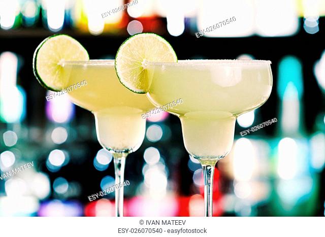 The margarita is a cocktail consisting of tequila mixed with orange-flavoured liqueur and lime or lemon juice, often served with salt on the glass rim