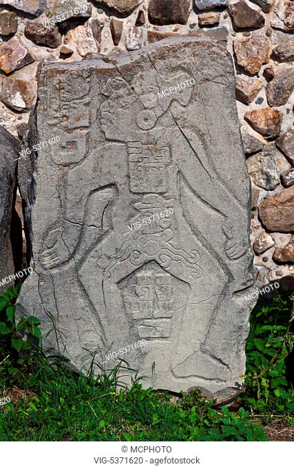 ZAPOTEC STELAE of royalty in front of the BUILDING OF THE DANCERS (Edificio de los Danzantes) in the GRAND PLAZA at MONTE ALBAN which dates back to 500 BC -...