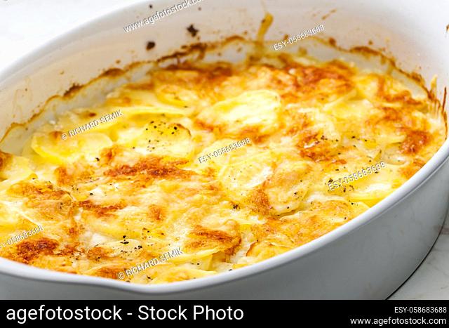 still ife of baked potatoes with cheese