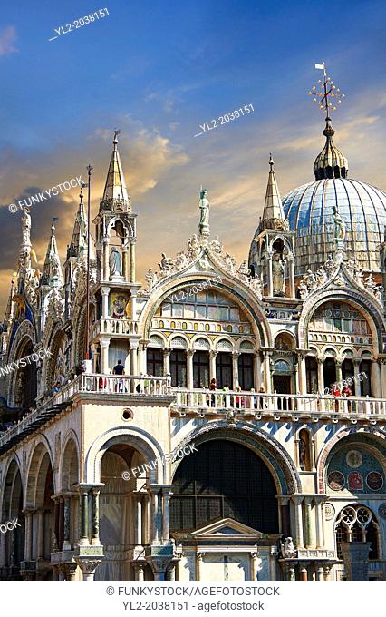 Facade with Gothic architecture and Romanesque domes of St Mark's Basilica, Venice