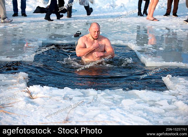 Bathing in the ice hole. Plunge into the ice water