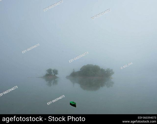 View to Liebesinsel isle at the german lake called Edersee with inversion weather condition