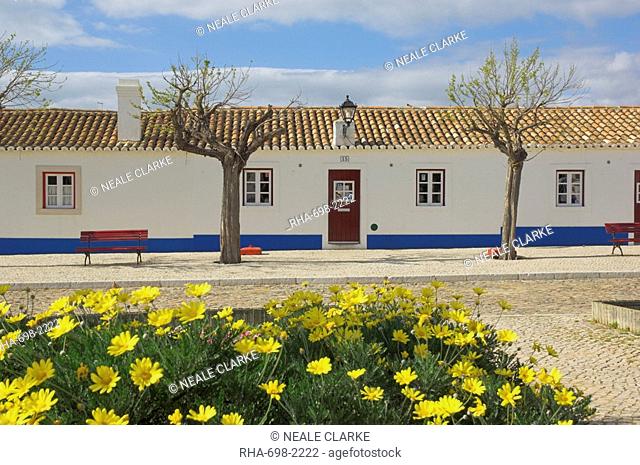 Traditional white and blue painted cottages in village centre, Porto Cova, Beja district, West Portugal, Europe