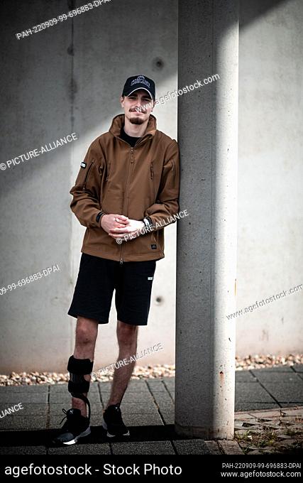 09 September 2022, North Rhine-Westphalia, Bochum: Professional soldier Aleksandr, called Sasha, stands in front of the hospital
