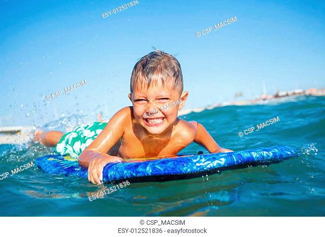 boy has fun with the surfboard