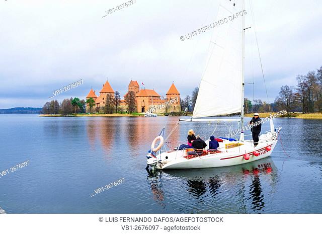 Sailing boat on lake Galve heading to Island Castle. Trakai, Lithuania