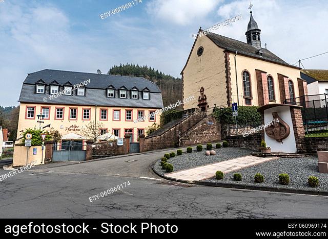 Auw An der Kyll, Rhineland-Palatinate - Germany Scenic view over the church, square and small park of the village at the German countryside