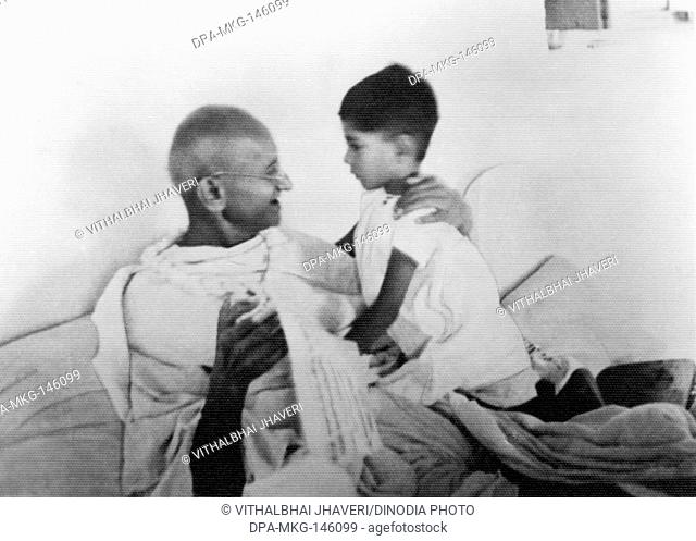 Mahatma Gandhi and his grandson Rajmohan on Gandhi's birthday at Birla House ; New Delhi ; 1937 ; India NO MR