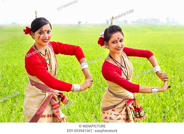 Portrait of women doing Bihu dance