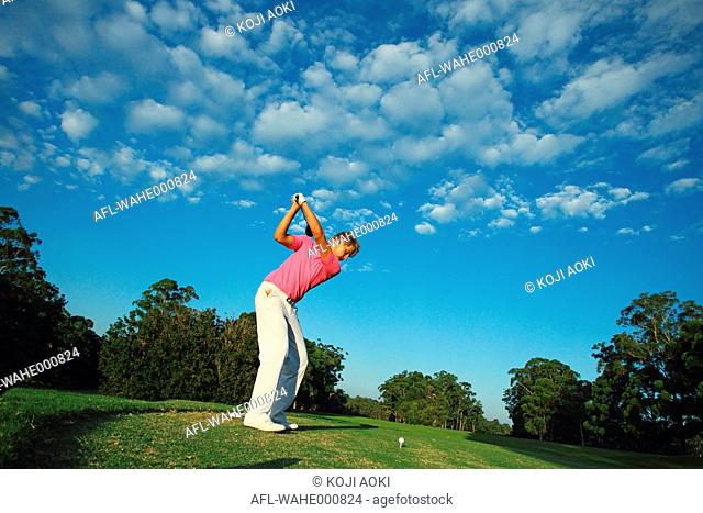 Golfer Concentrating on Tee