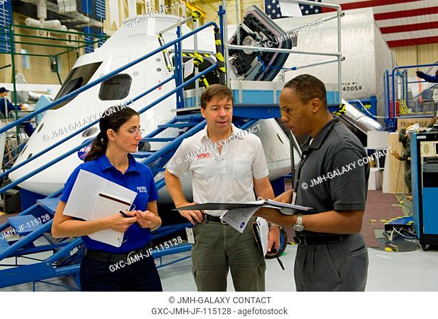 NASA astronauts Nicole Stott, Michael Barratt (center) and Alvin Drew, all STS-133 mission specialists, participate in an ingressegress timeline training...