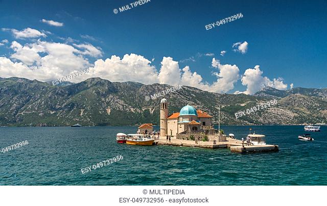 Perast, Montenegro - 07.11.2018. Our Lady of the Rocks church on an Island in the Bay of Kotor, Montenegro, in a sunny summer day