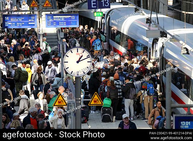 21 April 2023, Hamburg: Travelers try to board an ICE train to Munich at Hamburg Central Station. In Germany, rail traffic came to a virtual standstill on...