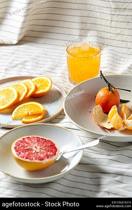 mandarin, grapefruit and glass of orange juice
