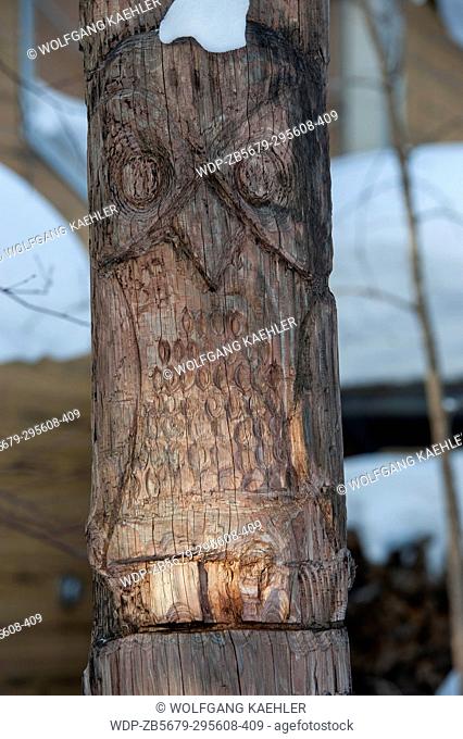 View of a carved wooden Ainu pole depicting an owl in Ainu Kotan, which is a small Ainu village in Akankohan in Akan National Park, Hokkaido, Japan