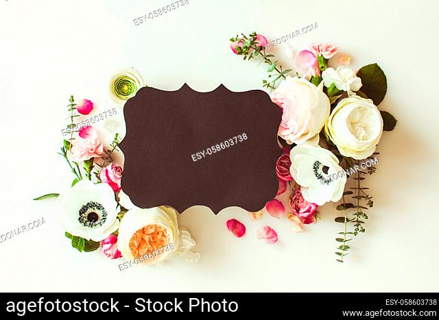 Floral round wedding frame flat lay. Rose flowers top view with copy space