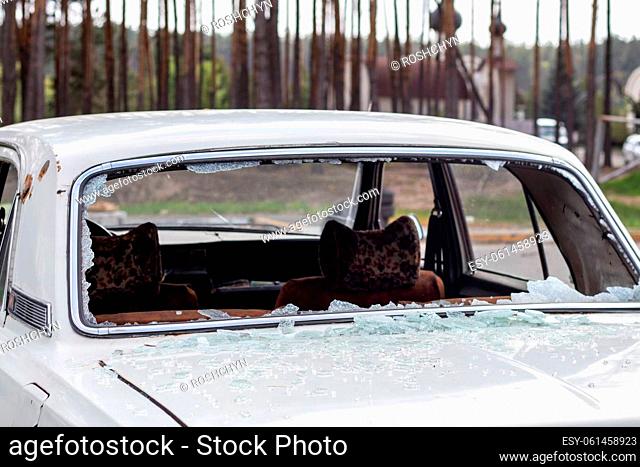 A car after an accident with a broken rear window. Broken window in a vehicle. The wreckage of the interior of a modern car after an accident