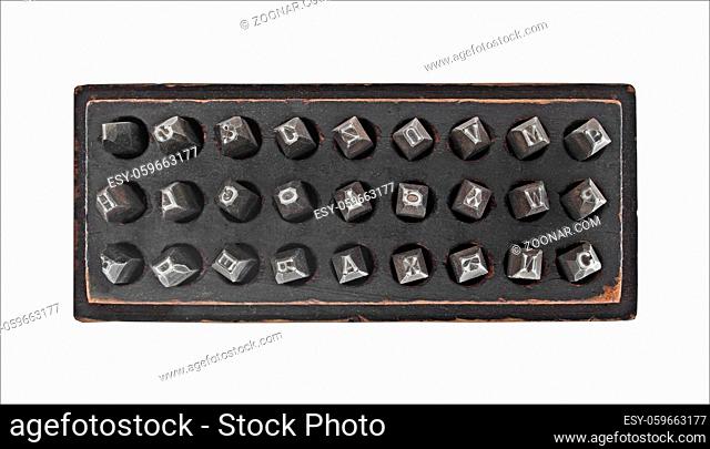 vintage metal lettering stamps punch set in a wooden box, clipping path