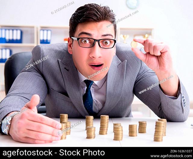 The businessman with golden coins in business growth concept