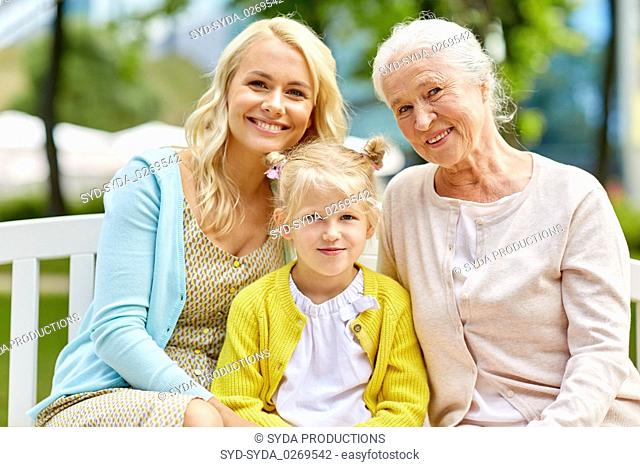 woman with daughter and senior mother at park