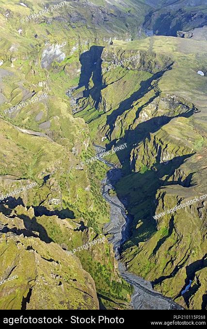 Aerial view over the mountain ridge Thorsmork / Þórsmörk / Thorsmoerk and Krossa river in summer in the south of Iceland