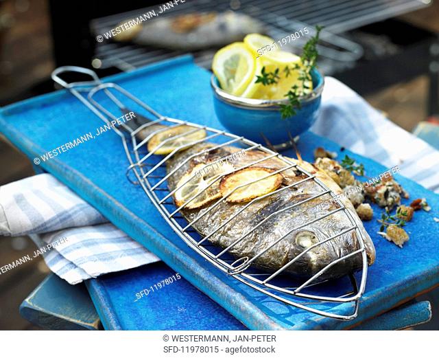 Grilled seabream with an olive and tomato filling