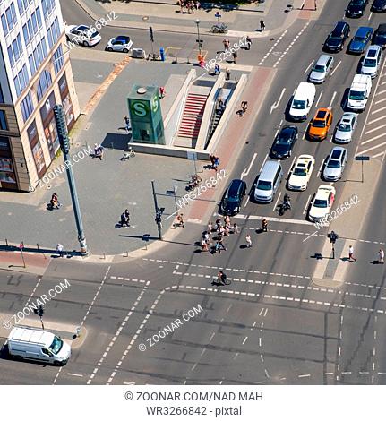 Berlin, Germany - june 9, 2017: Aerial of a crossroad / street traffic with cars and people at Potsdamer Platz in Berlin, Germany