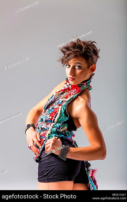 pretty brunette woman with a punk hairstyle and attitude