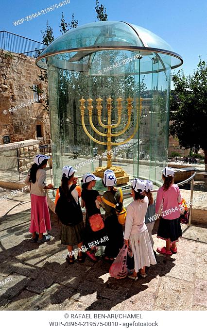 JERUSALEM - JULY 28:Visitors looks at the Jewish Temple Menorah replica at the Jewish quarter on July 28 2009 Jerusalem, Israel