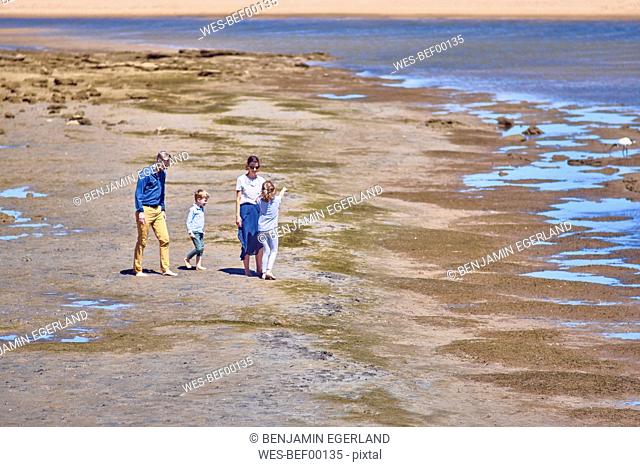 Australia, Adelaide, Onkaparinga River, family walking on the beach together