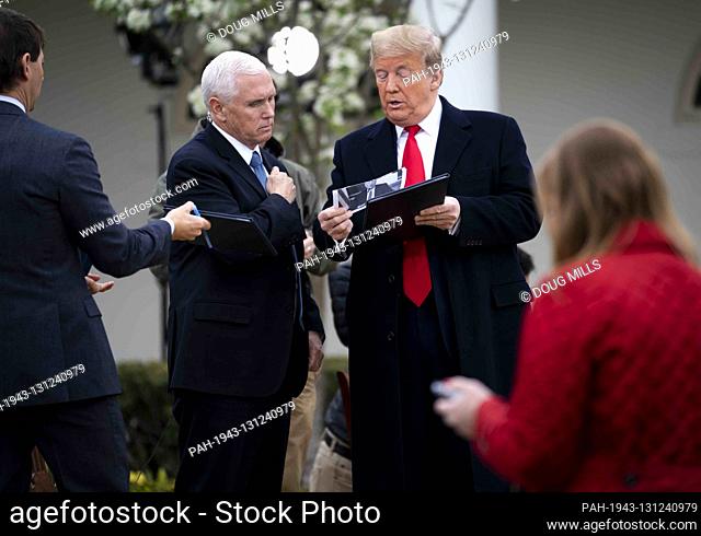 United States President Donald J. Trump and US Vice President Mike Pence look over some notes as they participate in a Fox News Virtual Town Hall with Anchor...