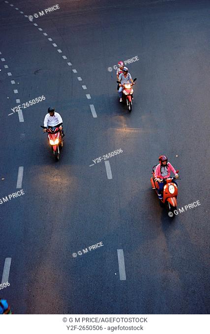 motor cycles take a turn near Silom, Bangkok