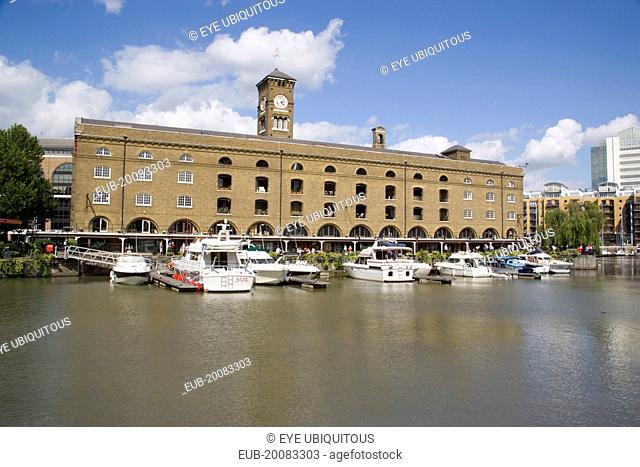 St Catherine’s Dock with yachts moored next to the former warehouses which are now luxury apartments