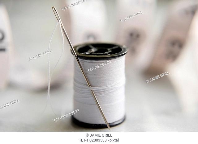White thread and needle