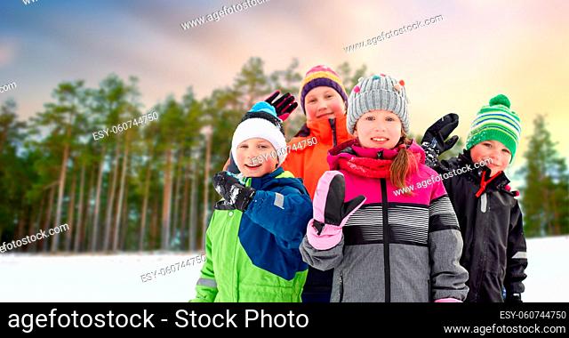 happy little kids in winter clothes outdoors