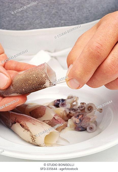 Preparing squid: removing the pen and skin