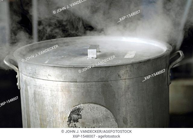 A steaming industrial sized cooking pot making food for a NASCAR race event  Dover International Speedway, Dover, Delaware, USA