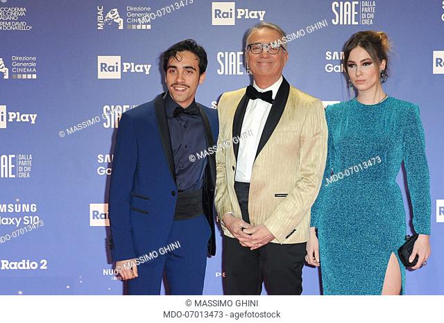 Italian actor and theater director Massimo Ghini and his children during the red carpet of the 64th edition of the David di Donatello