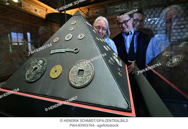 Marilyn Dorman and Michael Hans Lun Chou look at Chinese coins in the historical rooms of the Moritzburg Art Museum in Halle/Saale,  Germany, 16 September 2016