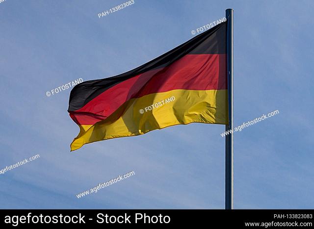 Dissen, Germany July 12th, 2020: Symbolic images - 2020 A Germany flag is waving in the wind on a flagpole, feature / symbol / symbolic photo / characteristic /...