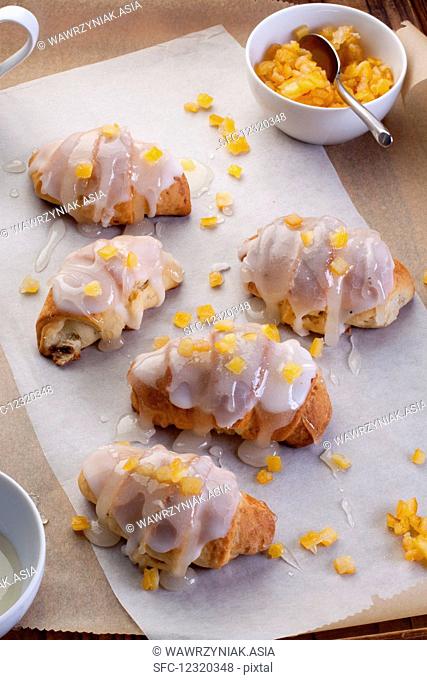 Croissants filled with jam and crystallized orange