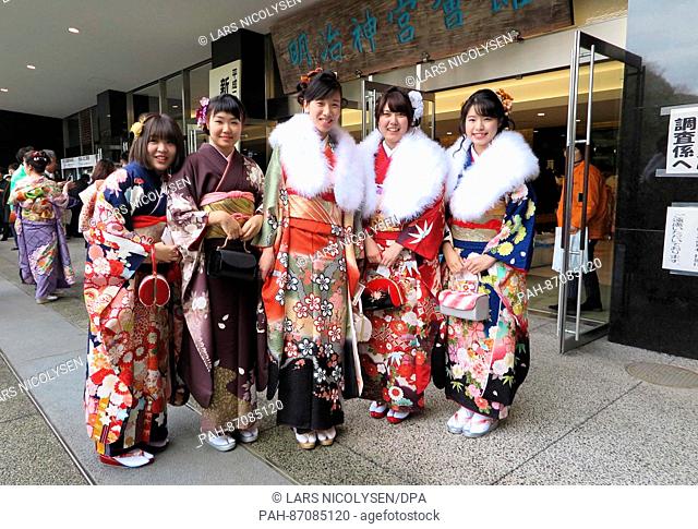 Japanese women wearing kimonos pose in front of the Meiji shrine in Tokyo, Japan, 8 January 2017. Young women who will be 20 years of age between the first of...