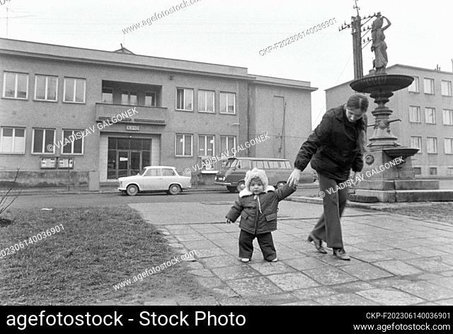 ***MARCH 21, 1975 FILE PHOTO***Mother and child (baby) front of House of Culture in Osoblaha, Czechoslovakia, March 21, 1975
