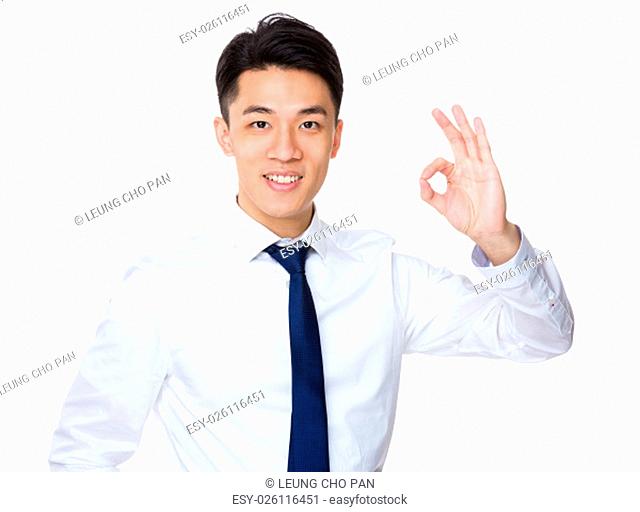 Young businessman with ok sign gesture