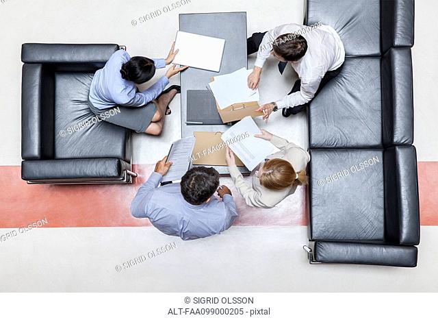 Executives in meeting, overhead view